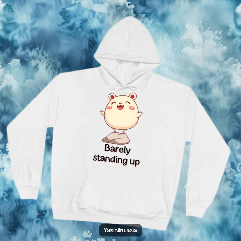 Funny bao bun hoodie, depicted grinning and balancing precariously on tiny legs, offering warmth and adorable humor.