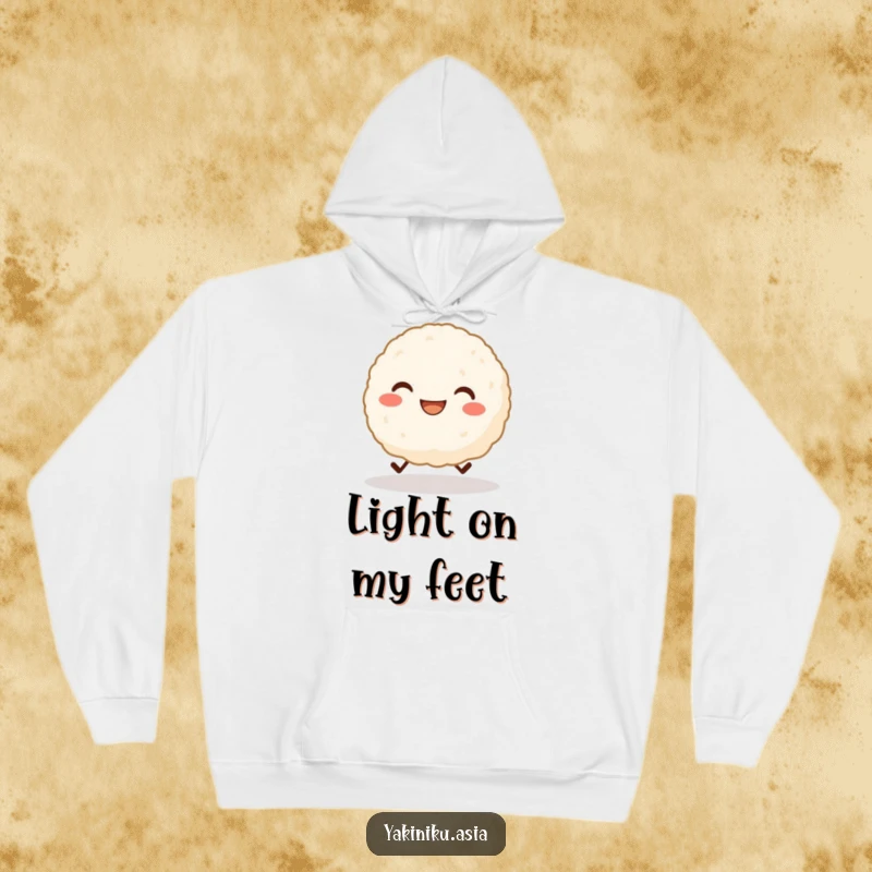 Funny hoodie with a grinning rice ball character with tiny legs cheerfully skipping, offering cozy comfort and happy vibes. Excellent funny gift.
